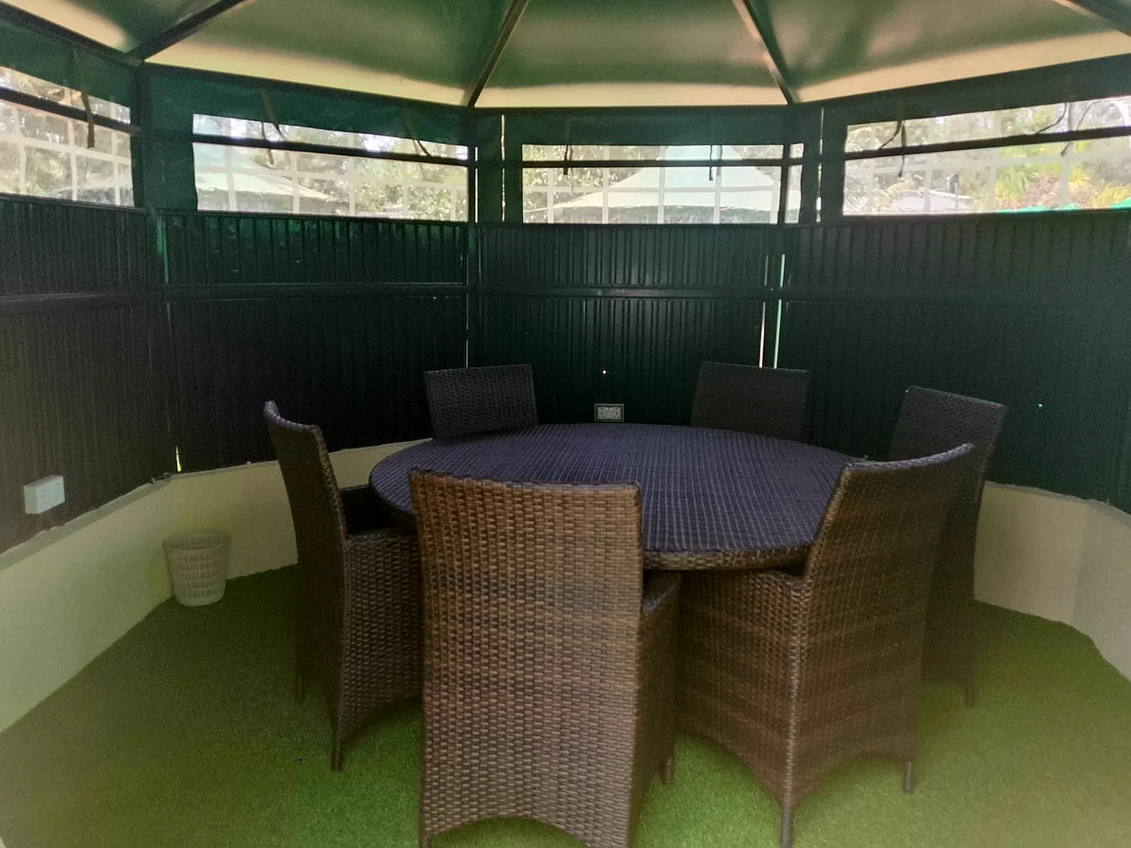 Dining table set inside a garden gazebo
